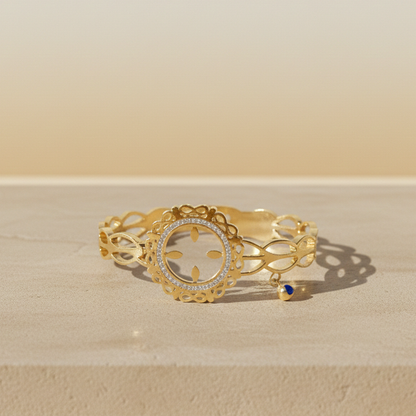 Golden Filigree Halo Bracelet with Blue Charm