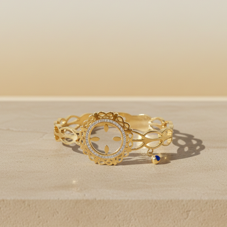 Golden Filigree Halo Bracelet with Blue Charm